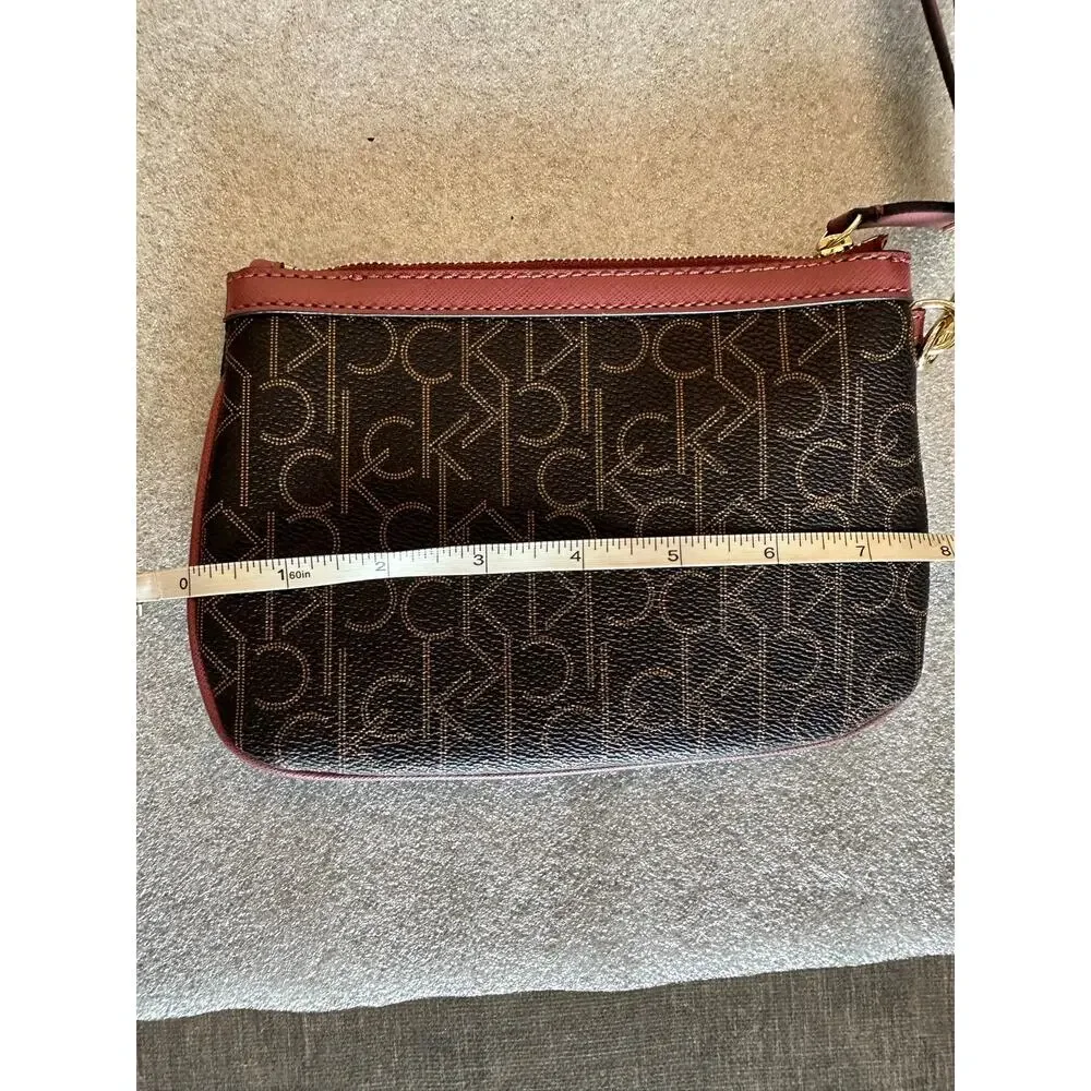 EUC Calvin Klein CK Monogram Wristlet Brown Burgundy Gold Zip Clutch RN54163
